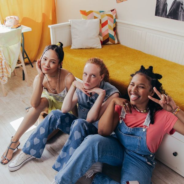 Group of diverse people sitting in a relaxed circle, smiling.